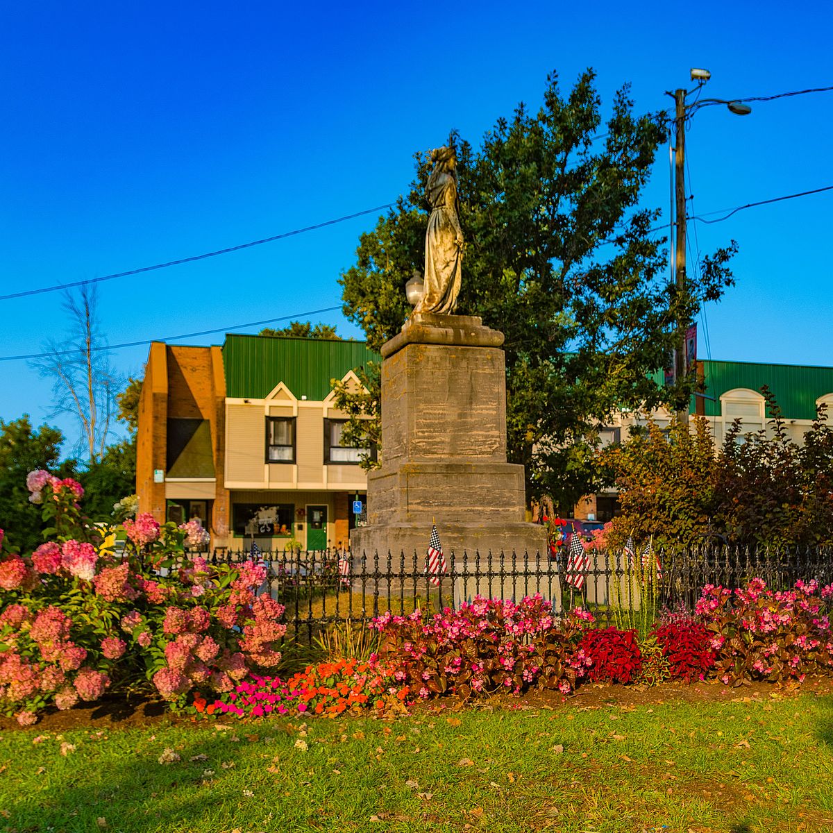 statue and flowers in Swanton